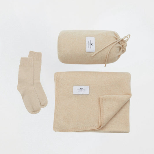 front flat lay of the beige cashmere shawl with travel pouch and ankle socks set
