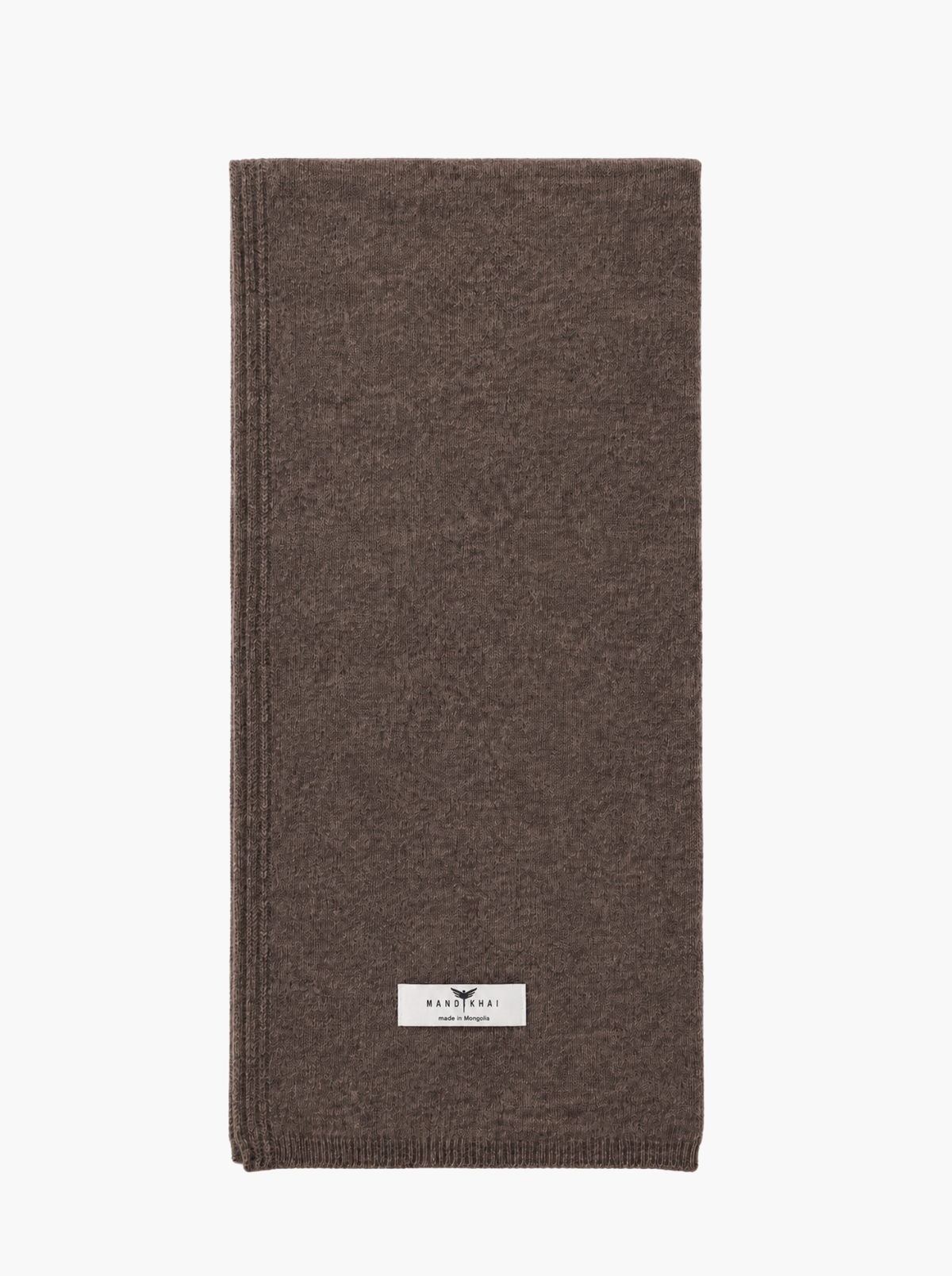 A folded brown knit scarf with a small white rectangular brand label near the bottom, shown on a plain white background.