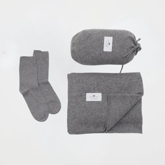 front flat lay of the grey cashmere shawl with travel pouch and ankle socks set