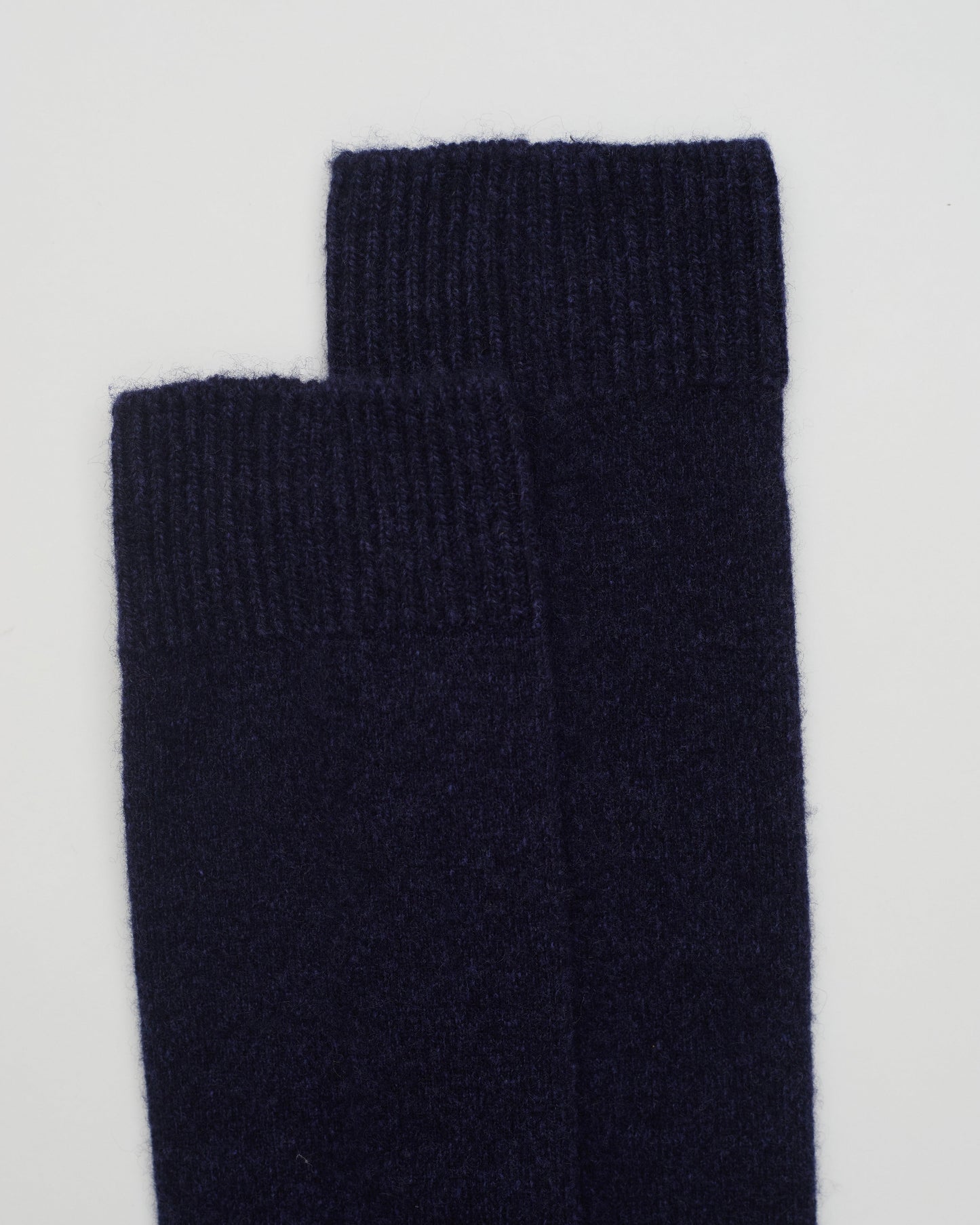 Close up flat lay of Navy Melange Cashmere Long Socks with ribbed knit detail