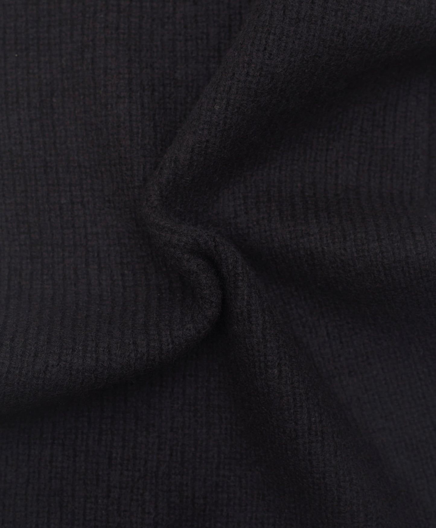 black cashmere ribbed knit scarf close up detail of knit texture
