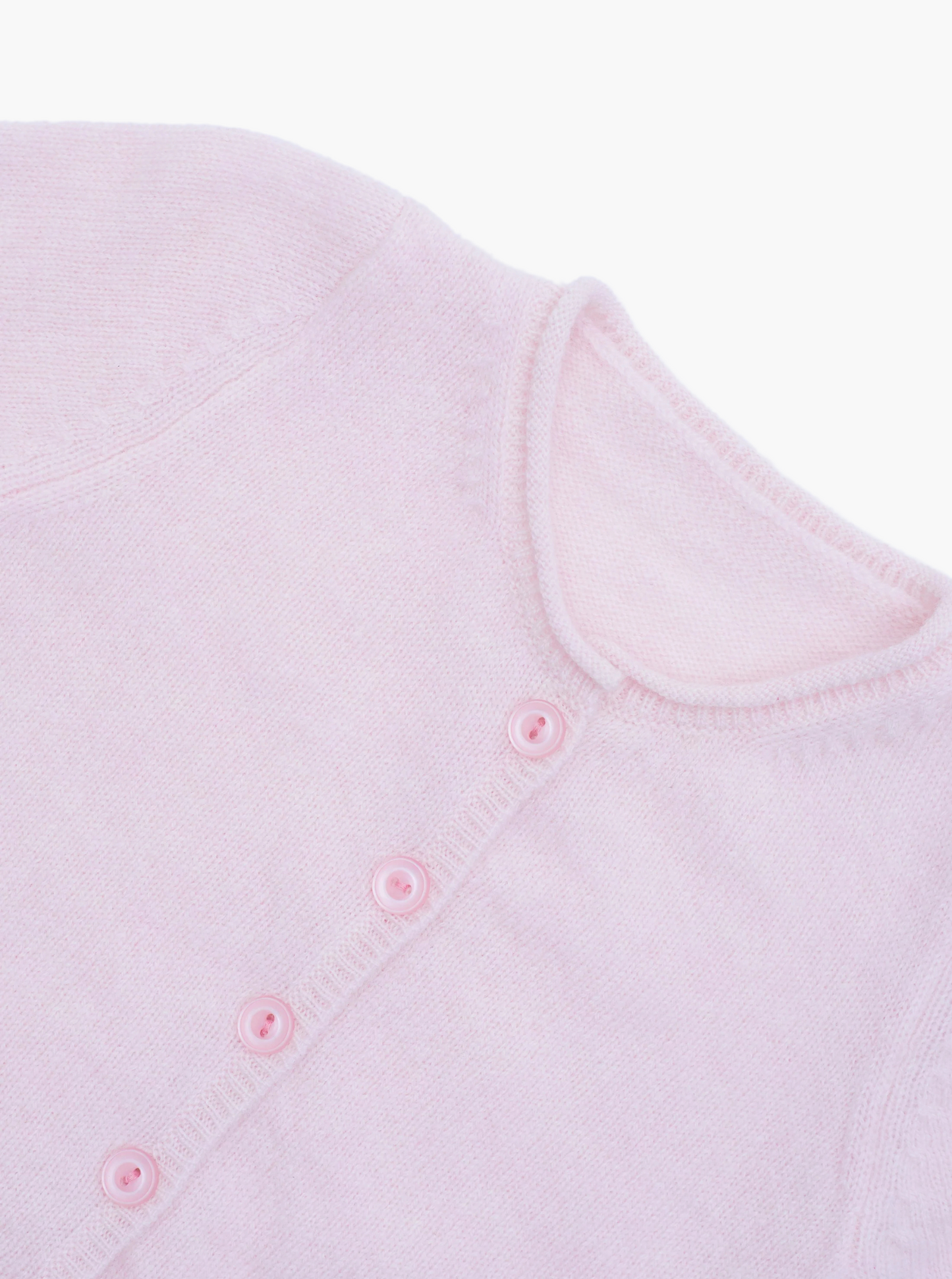 Close up button detail of the light pink baby cashmere cardigan