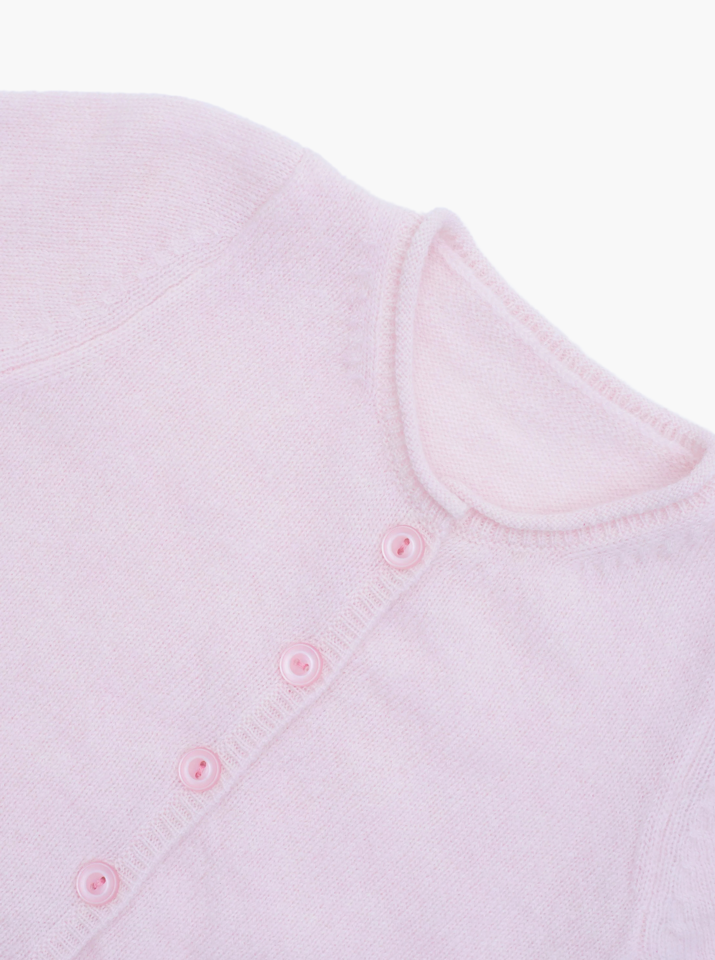Close up button detail of the light pink baby cashmere cardigan