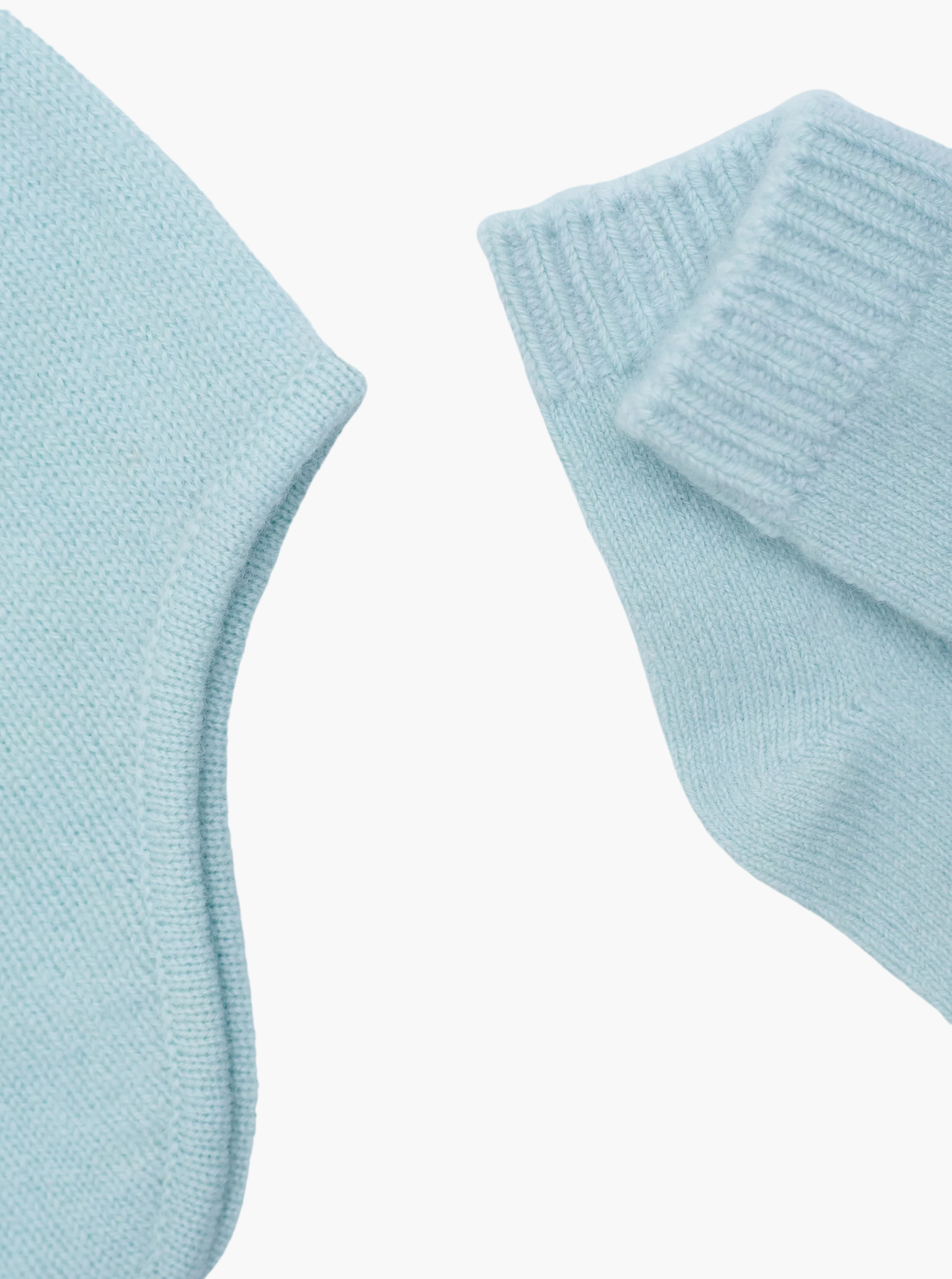 flat lay of the mint green cashmere baby hat and socks set