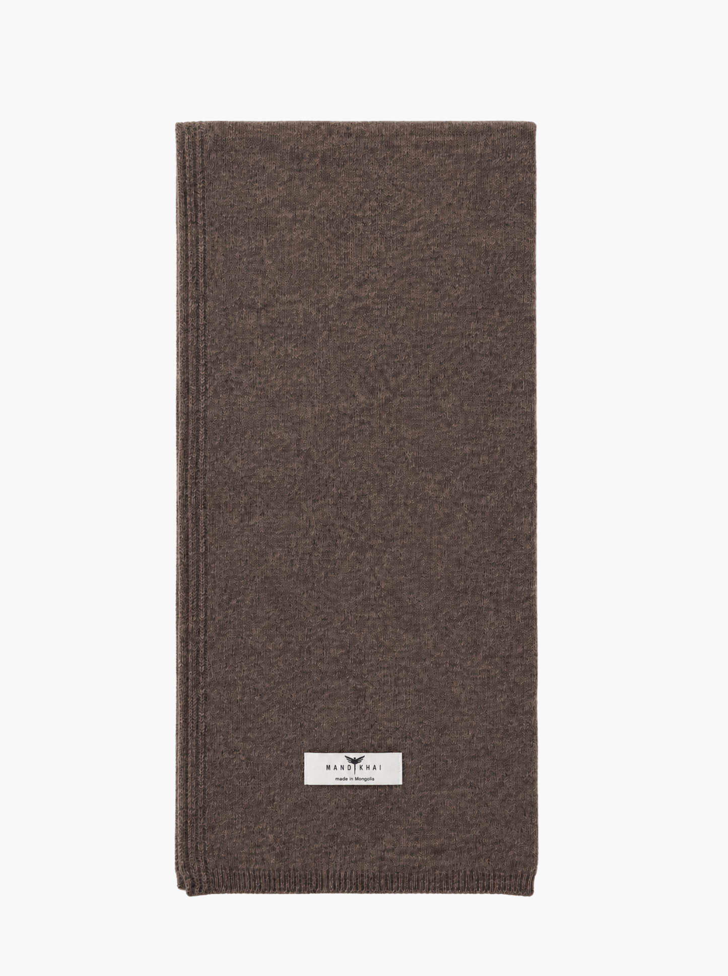 A folded brown knit scarf with a small white rectangular brand label near the bottom, shown on a plain white background.