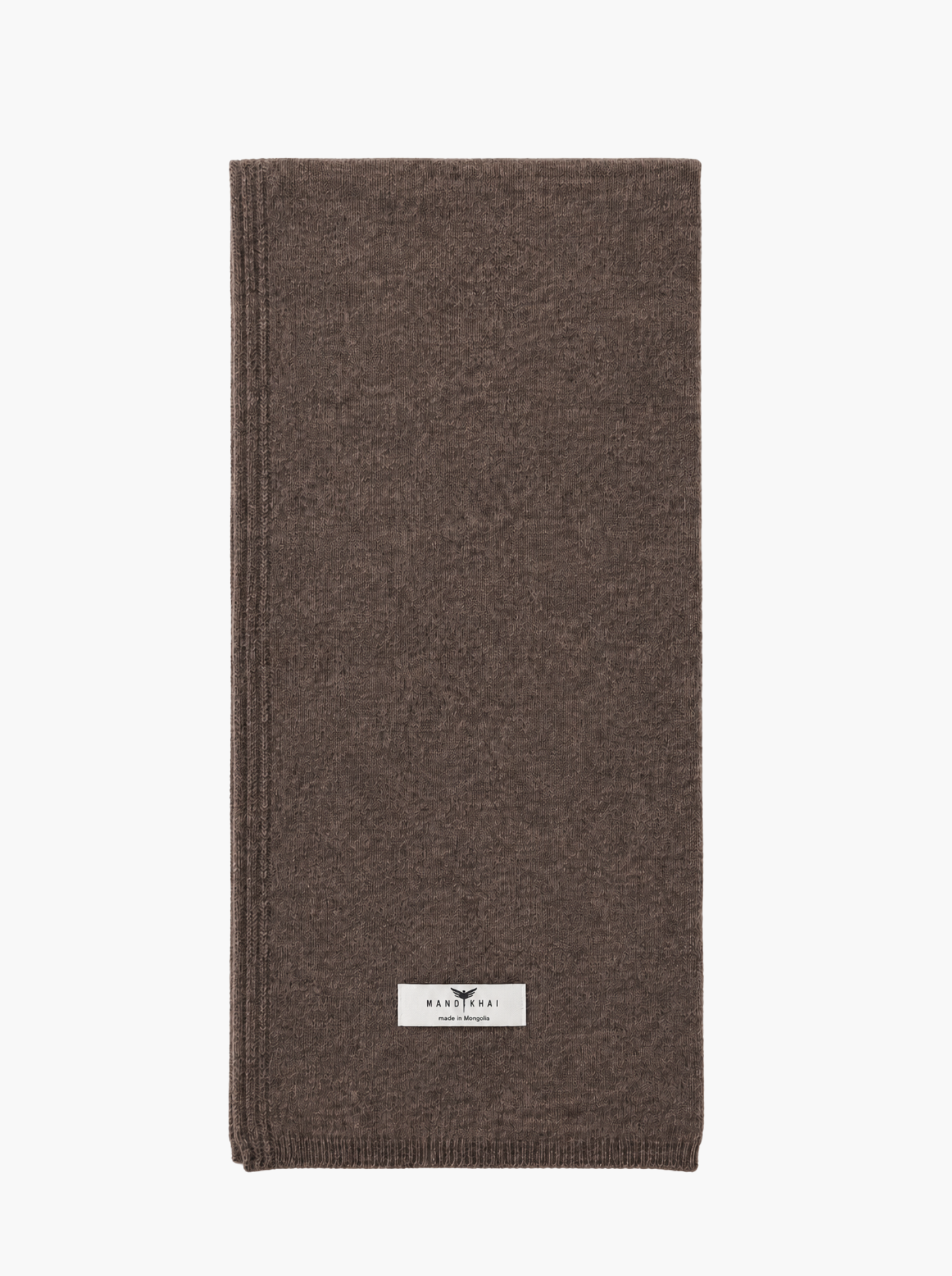A folded brown knit scarf with a small white rectangular brand label near the bottom, shown on a plain white background.