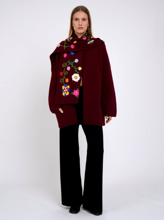 Burgundy cashmere hip length jacket with a detachable scarf which is hand embroidered with bright coloured flowers.
