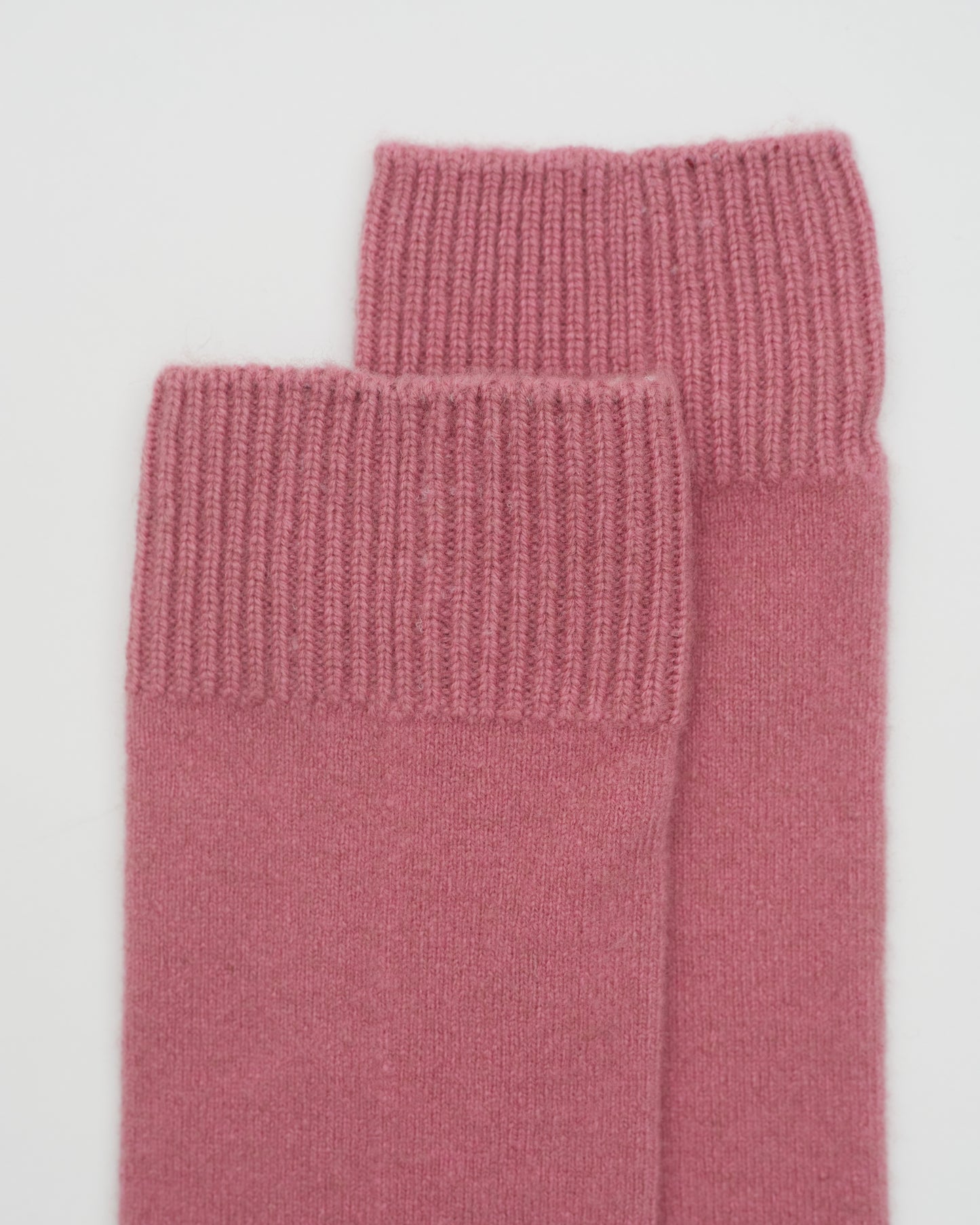 Close Up Flat Lay of Dusty Pink Cashmere Long Socks with ribbed knit detail 