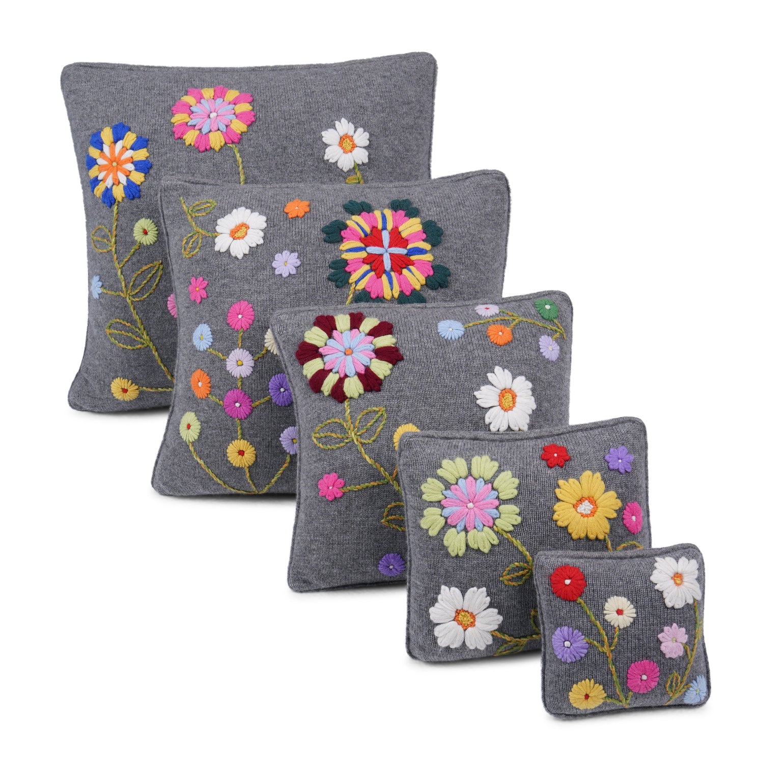 Set of five matching grey cashmere cushions in different sizes all with unique coloured floral hand embroidery.