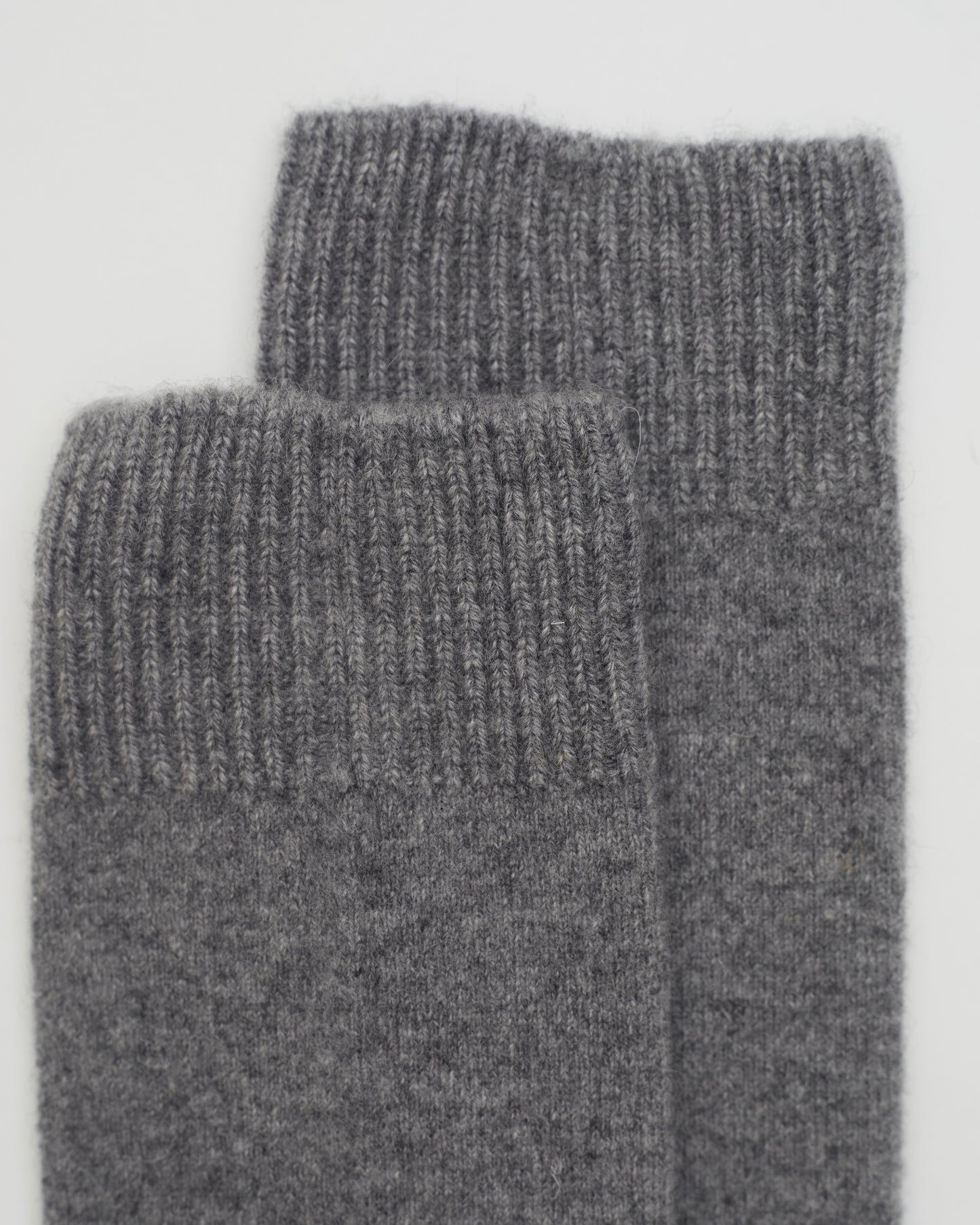 Close up flat lay of Grey Cashmere Long Socks with ribbed knit detail 