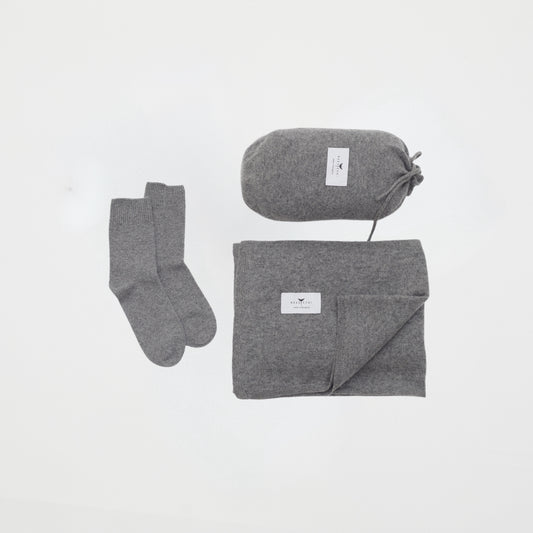 front flat lay of the grey cashmere shawl with travel pouch and ankle socks set 