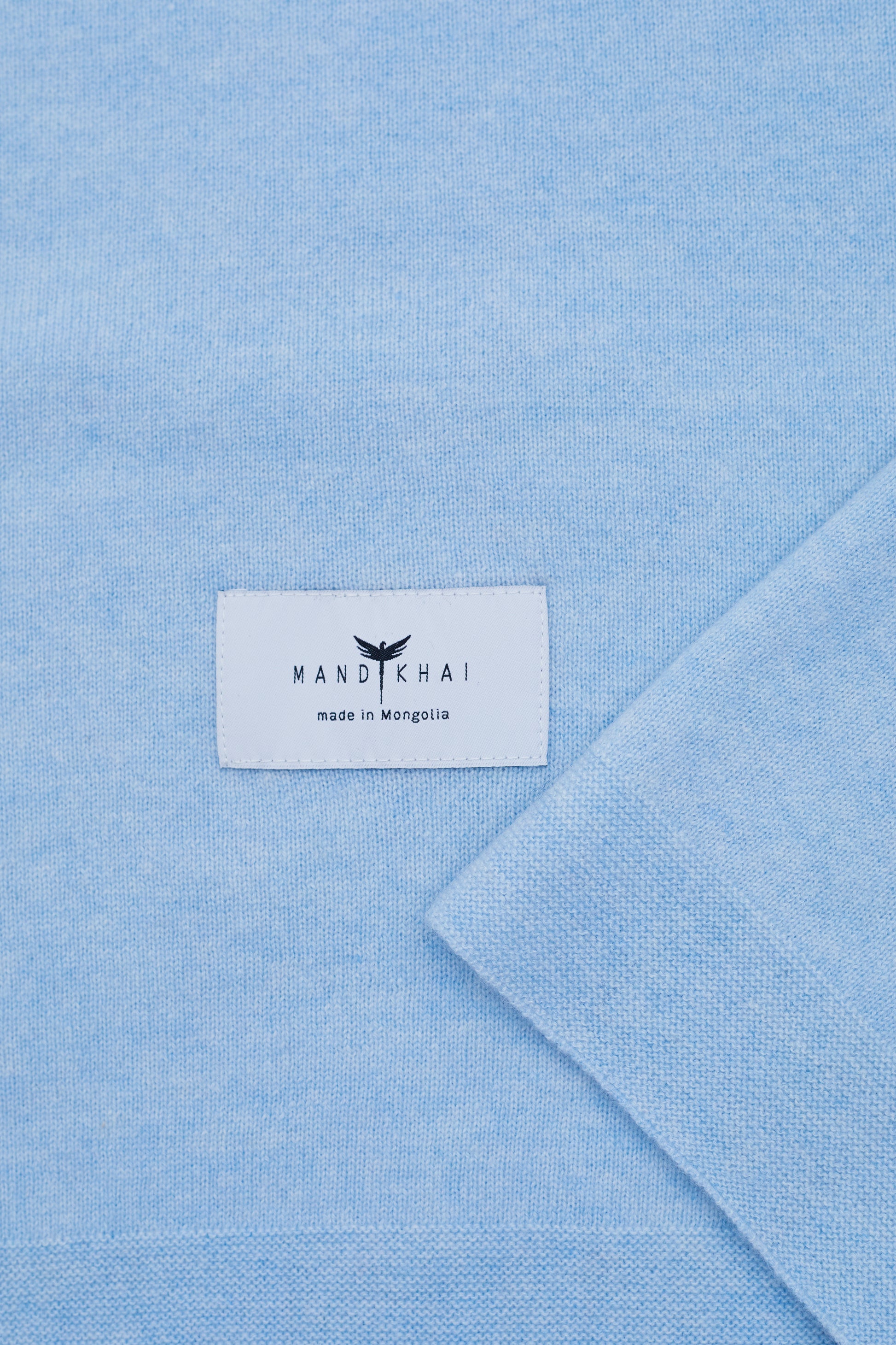 close up flat lay of the Light Blue Baby Cot Cashmere Blanket 