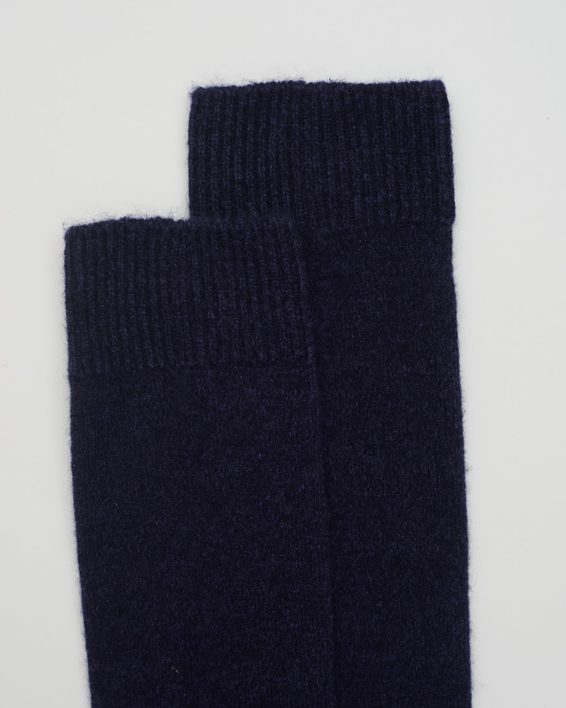 Close up flat lay of Navy Melange Cashmere Long Socks with ribbed knit detail 