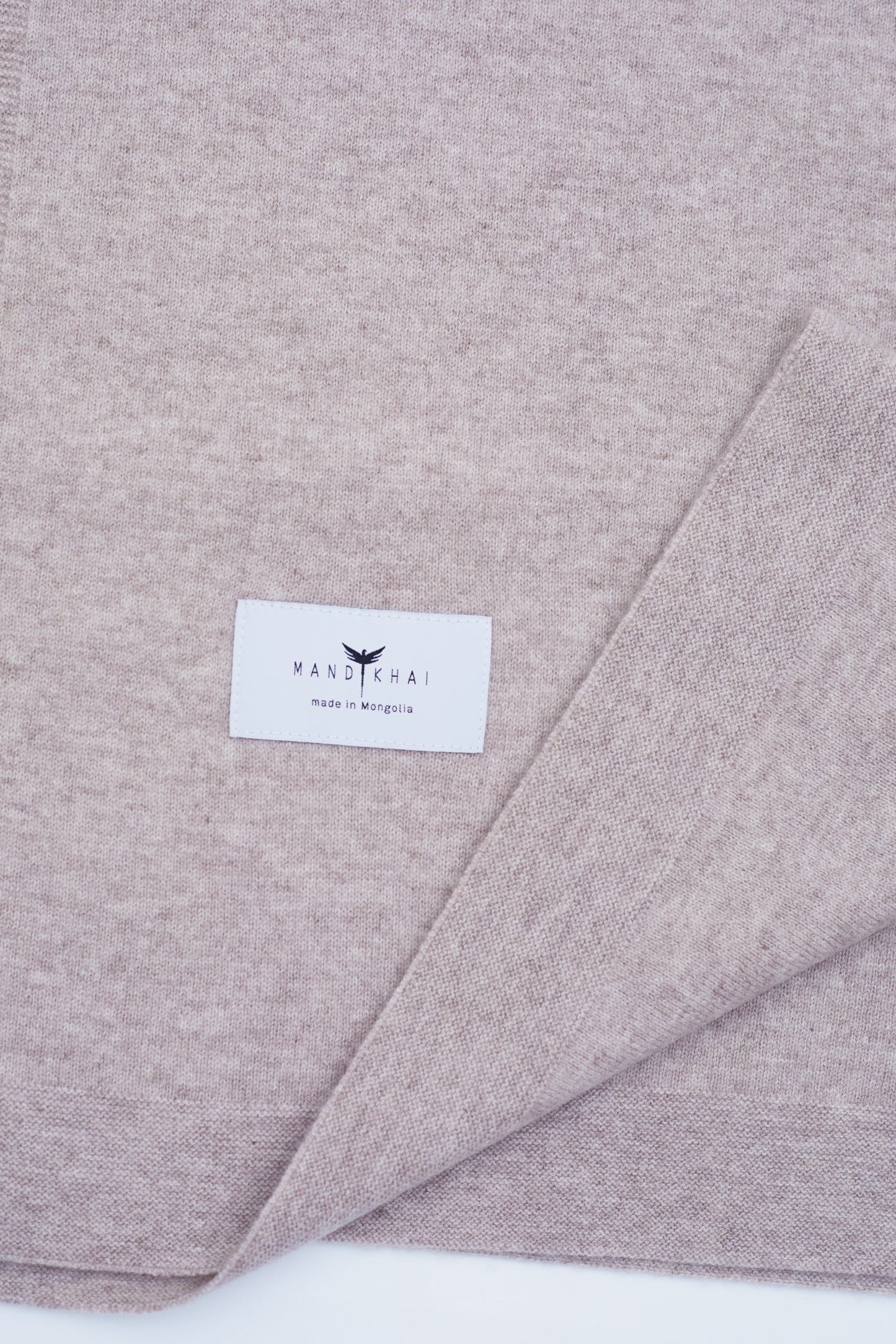 close up flat lay of the New Beige Baby Cot Cashmere Blanket 