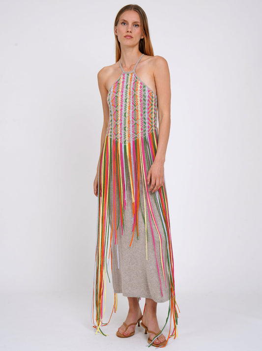 model wears summer weight cashmere knit dress with thin halterneck straps and decorated with coloured fringes