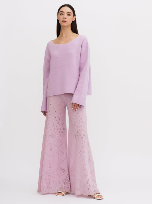 Light purple-pink wide-leg cashmere pants with ajur knit design and flowing silhouette.