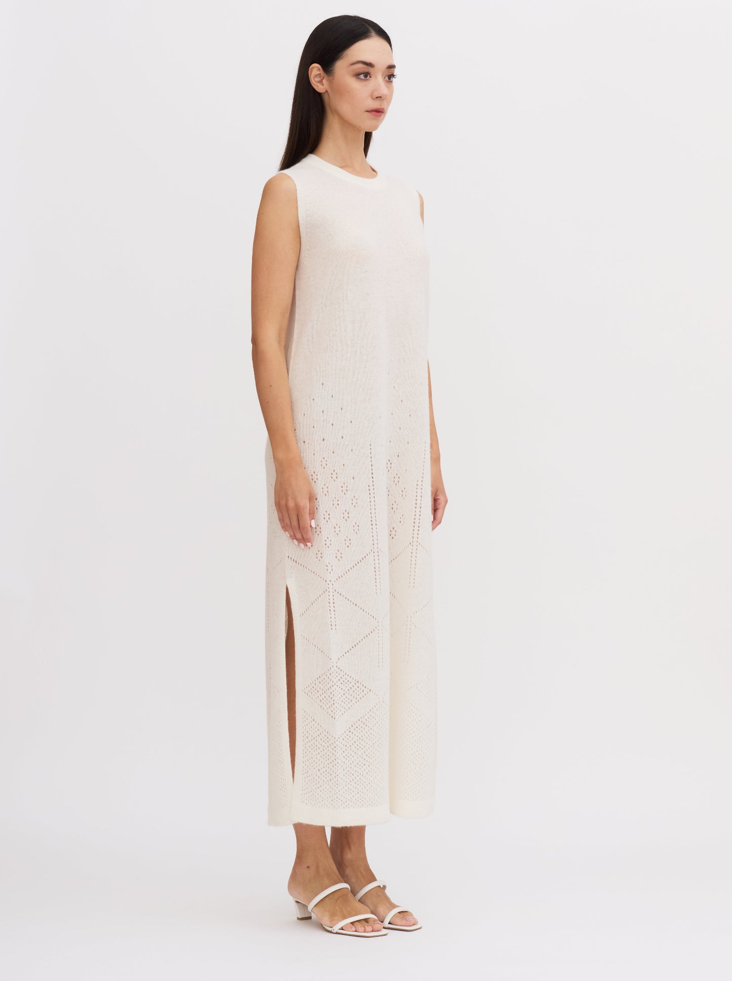 White sleeveless cashmere maxi dress with ajur knit design and geometric patterns at the hem