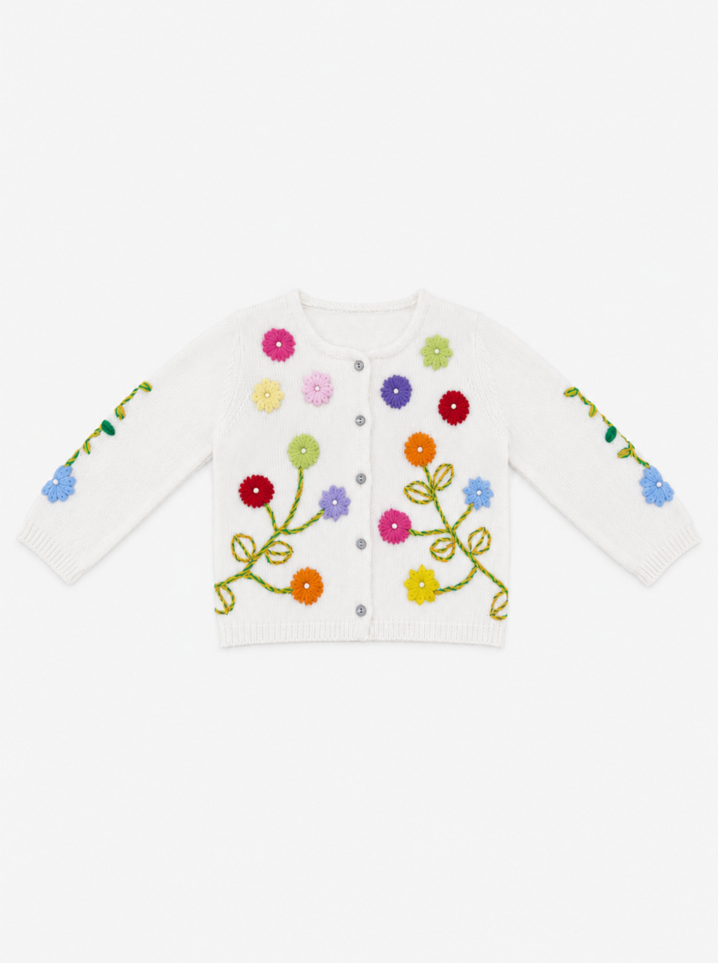 A white knit cardigan sweater with colorful embroidered flowers and green stems, featuring a snap-button front and long sleeves, shown against a plain white background.