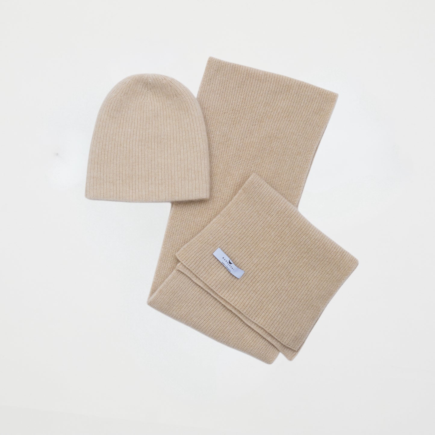 front flat lay of the beige cashmere ribbed knit hat and scarf set