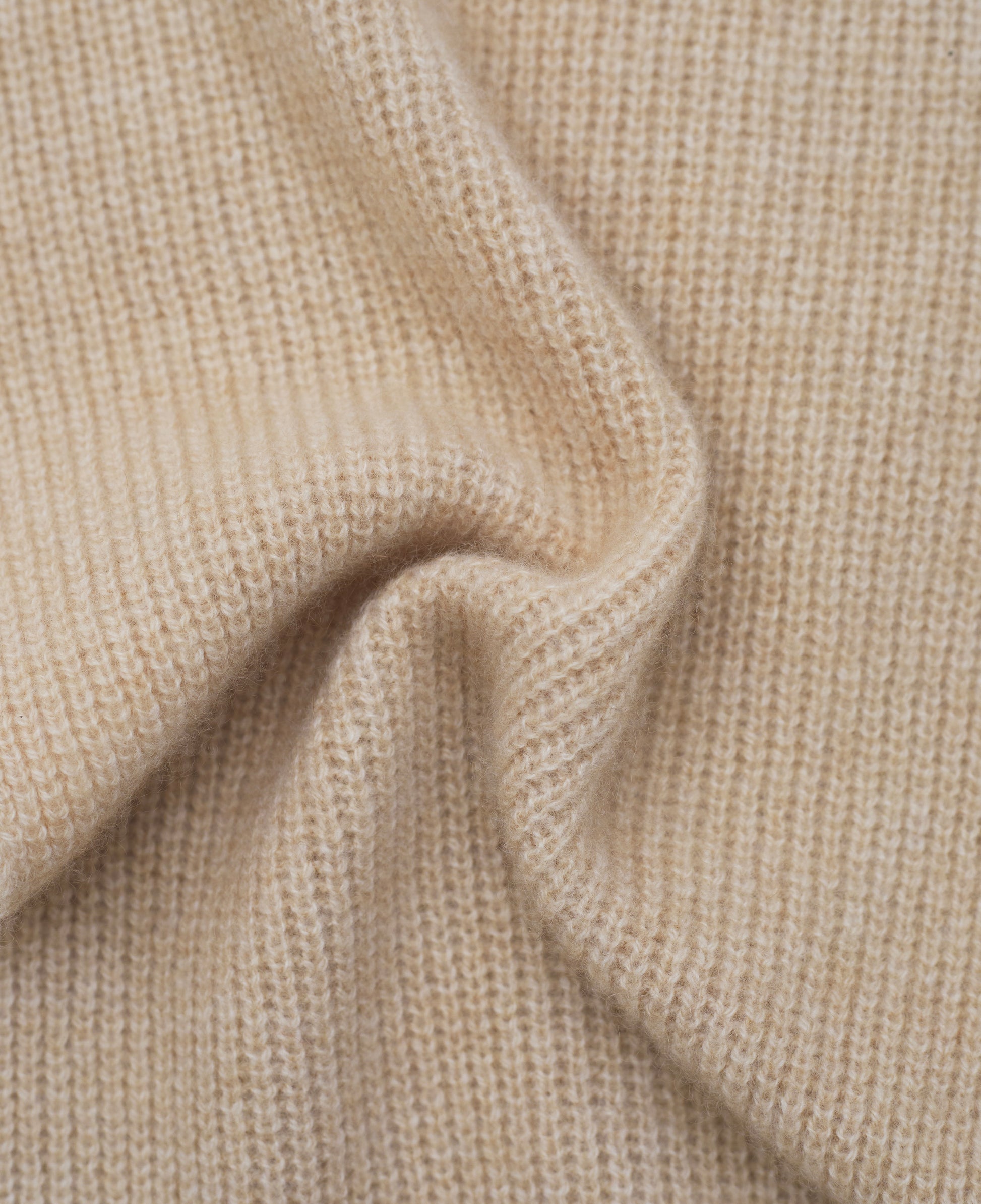 beige cashmere ribbed knit  scarf close up detail of knit texture