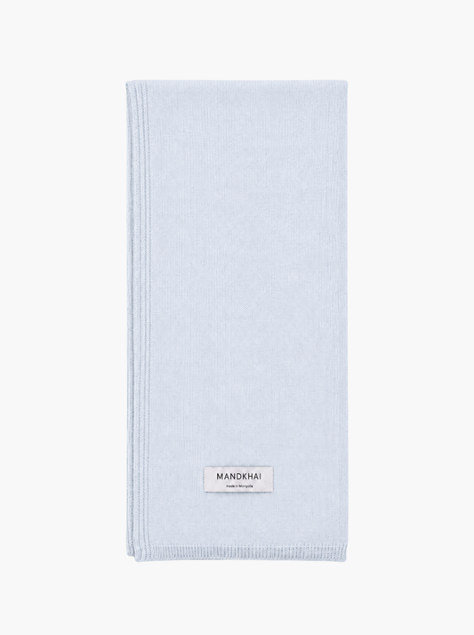 A light blue folded pure cashmere scarf.