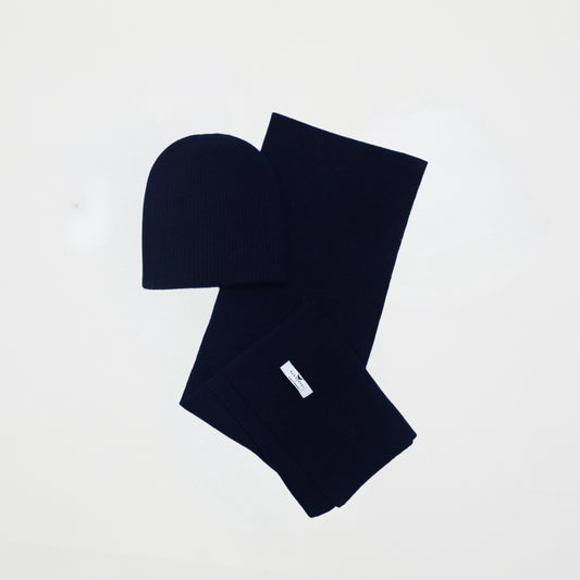 front flat lay of the dark navy cashmere ribbed knit hat and scarf set