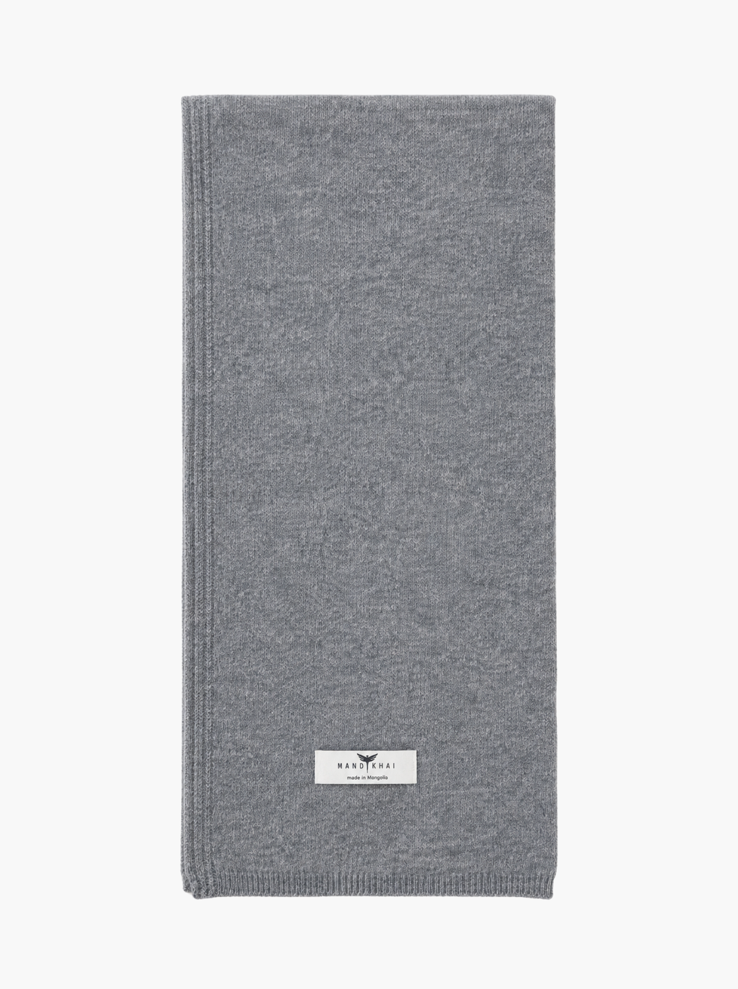 A folded gray knit scarf with a small white brand label near the bottom, shown against a plain white background.