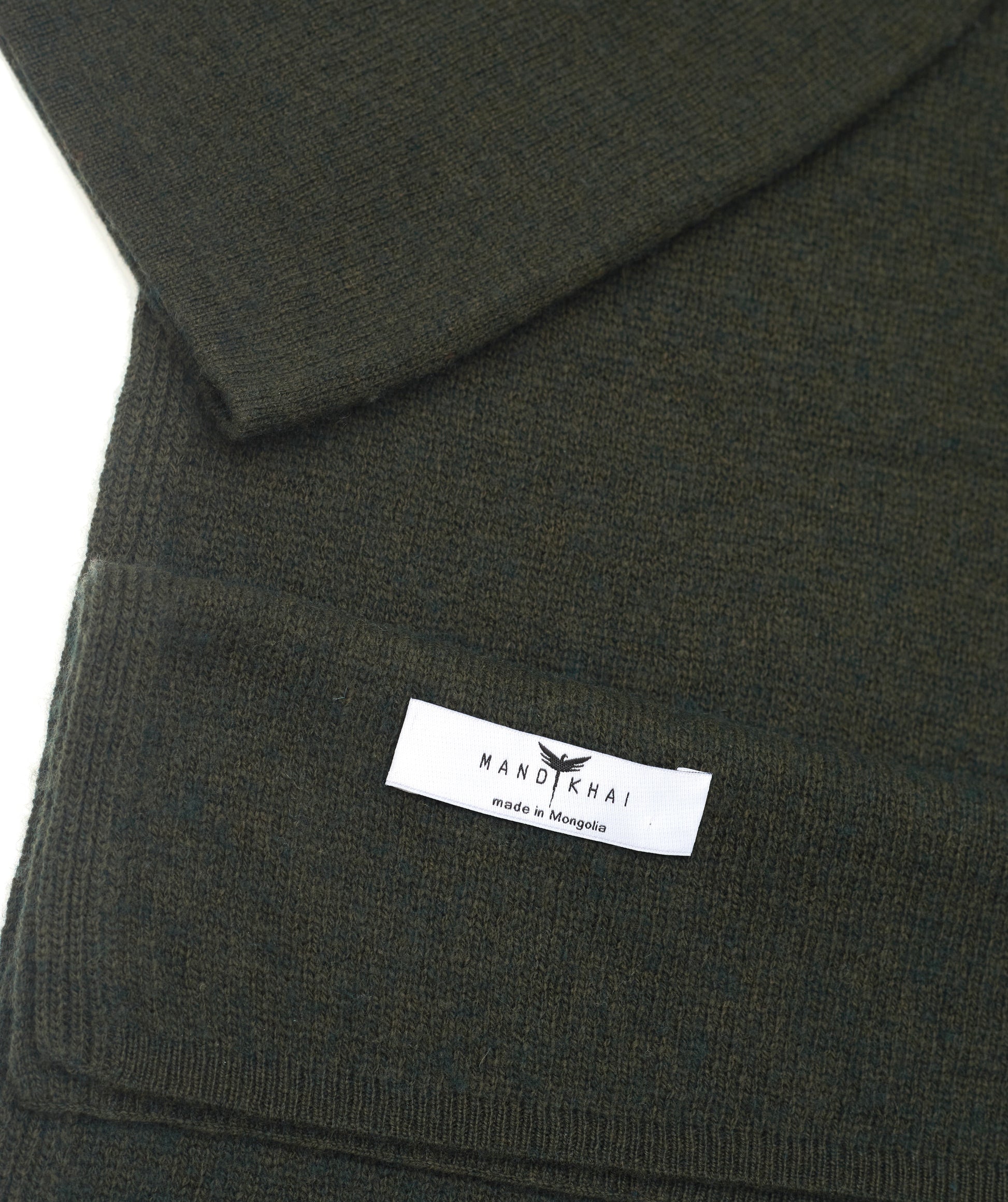 flat lay close up khaki cashmere scarf and hat set with mandkhai label detail 