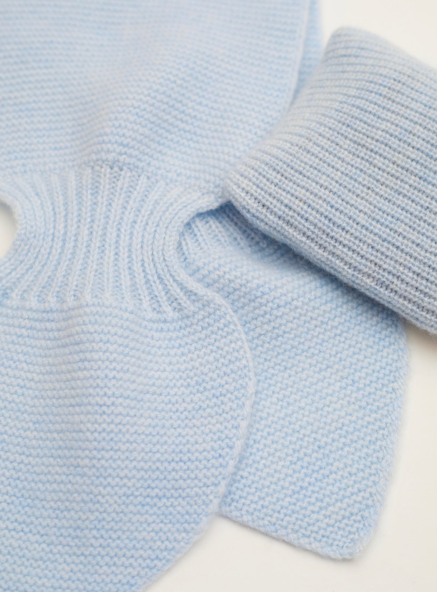 Close up Flat lay of light blue cashmere neck scarf and light blue mini lavender cushion set