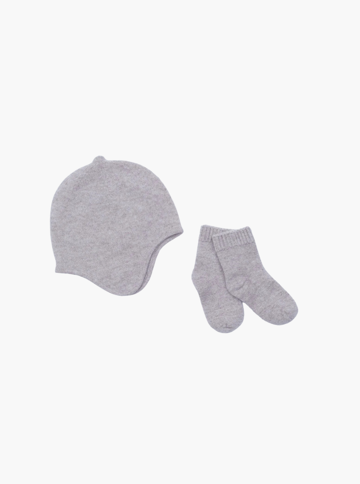 flat lay of the light brown cashmere baby hat and socks set