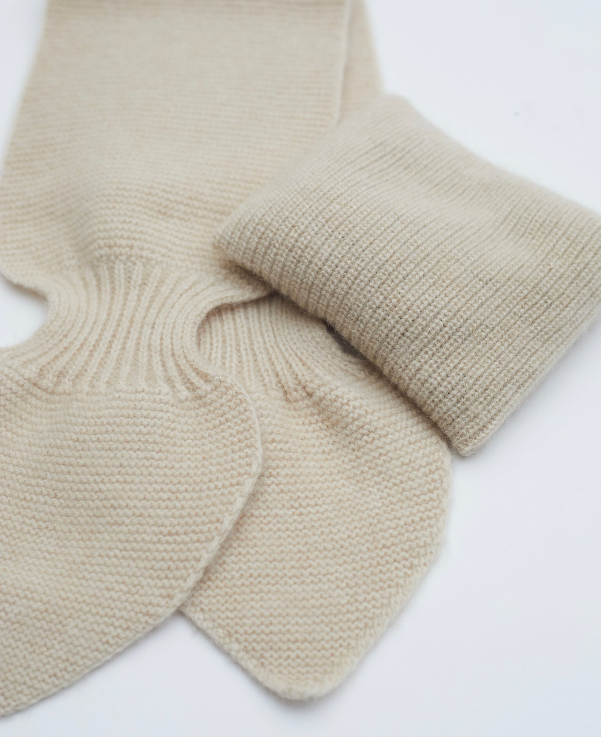 Close up Flat lay of light brown cashmere neck scarf and light brown mini lavender cushion set