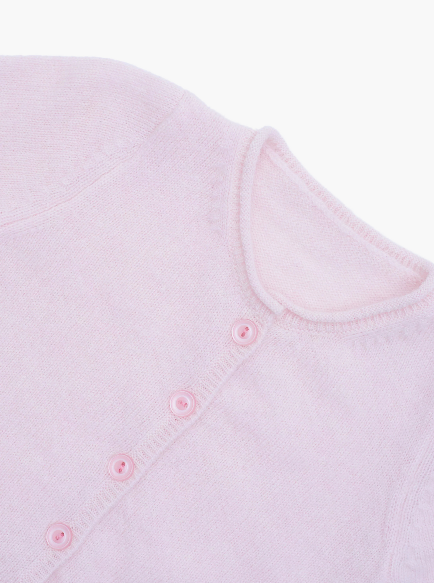 Close up button detail of the light pink baby cashmere cardigan 