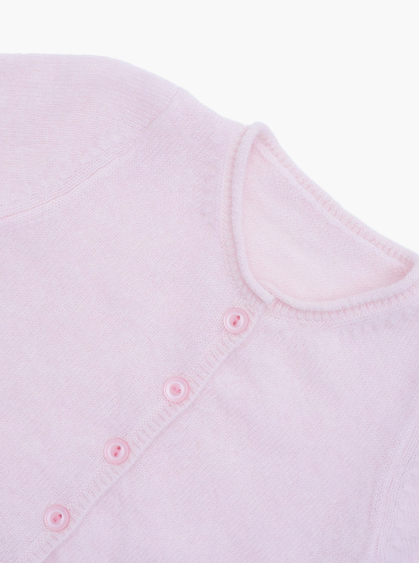 Close up button detail of the light pink baby cashmere cardigan 