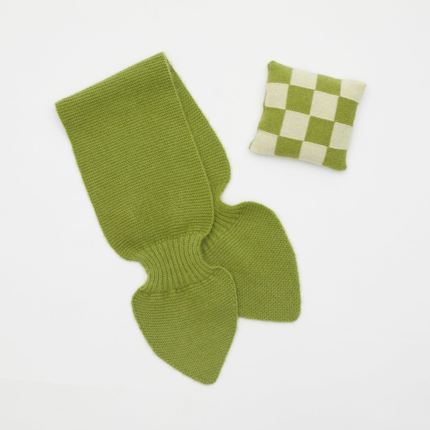 Flat lay of olive green cashmere neck scarf and olive green and light yellow checked mini lavender cushion set 