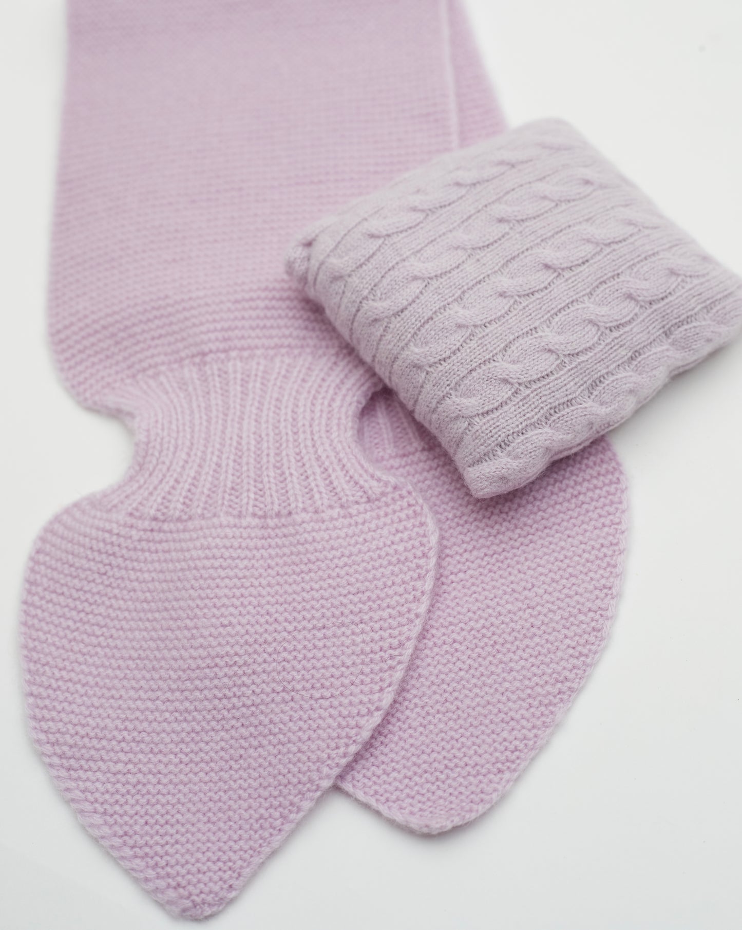 Close up Flat lay of purple pink cashmere neck scarf and cable knit purple pink mini lavender cushion set 